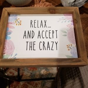 Small sign: "Relax...and accept the crazy"